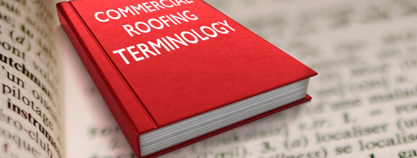 A thick dictionary with the words “commercial roofing terminology” on the cover.
