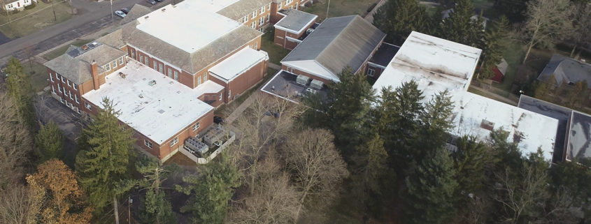 Aerial shot of school complex roofing system.