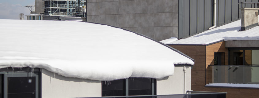 Heavy snow on a commercial roof.