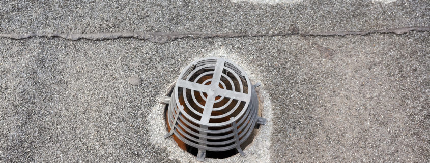 Ponding water caused by clogged roof drains.