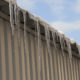 Commercial roof damage caused by ice and snow.