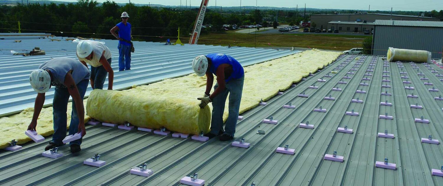 Installation of a Butler Roofing system.