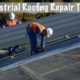 Two men conducting an industrial roof repair on a commercial building.